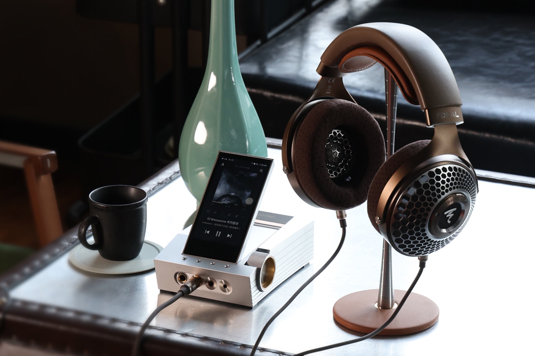 Focal headphones resting on ddHiFi HS270 stand with cable and desktop amp