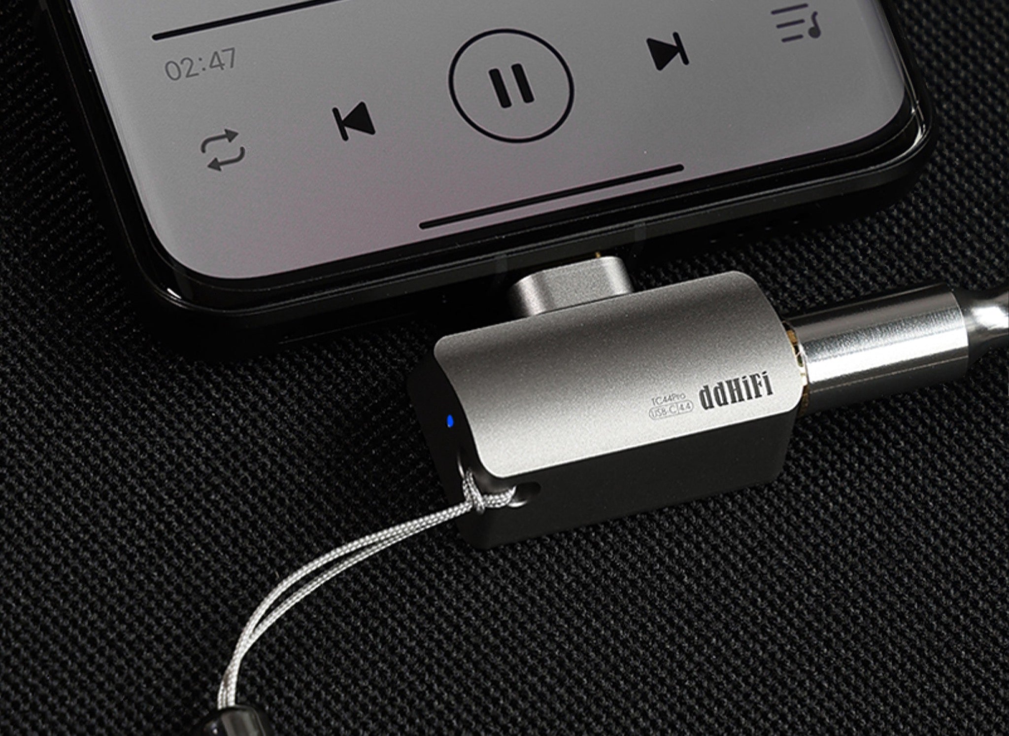 ddHiFi TC44Pro USB-C connected to mobile phone with attached lanyard, highlighting indicator light
