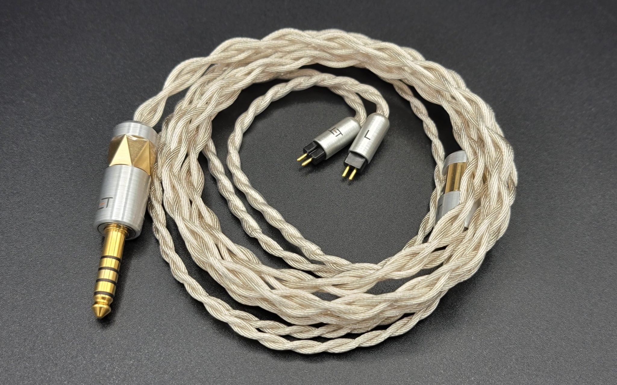 Eletech Iliad cable bird's eye coiled over gray background