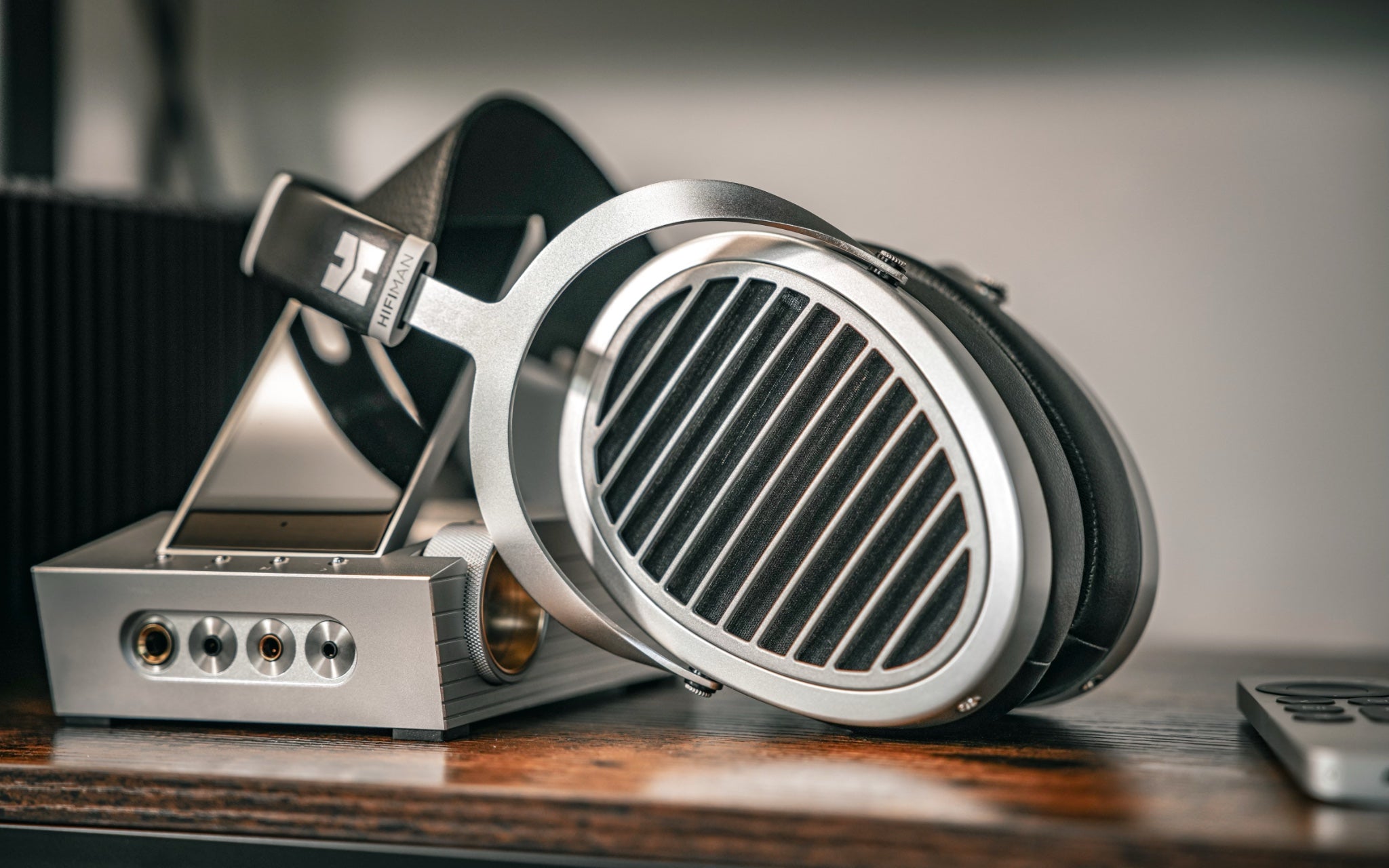 HiFiMAN Ananda Nano headphone leaning against A&K ACRO CA1000 portable amp from Bloom Audio gallery