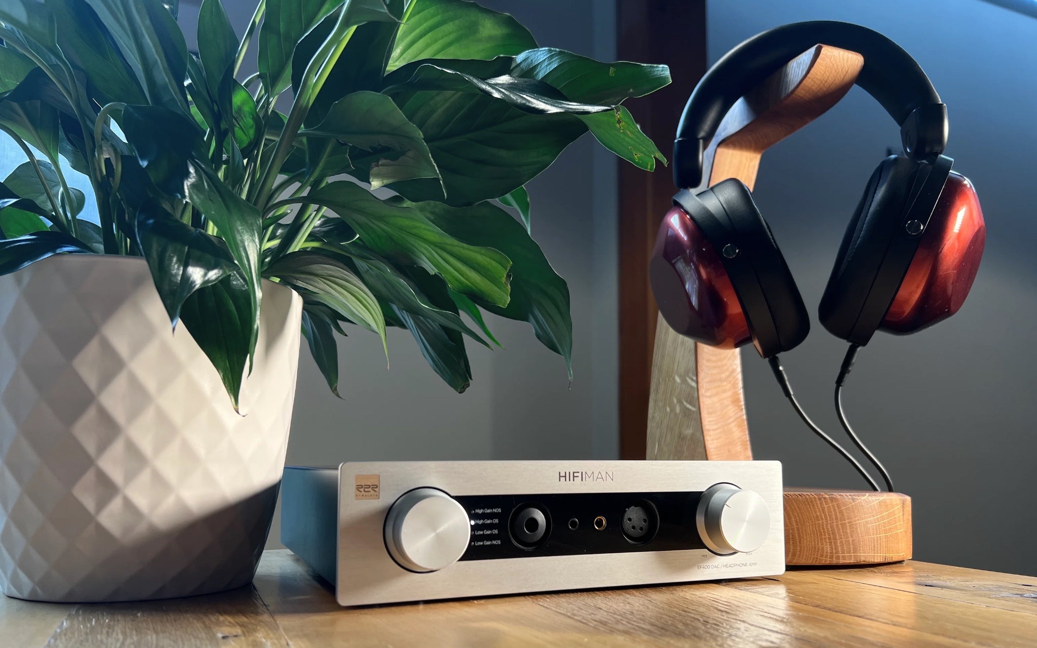 HiFiMAN EF400 amp with closed back headphones, stand and plant from Bloom Audio gallery