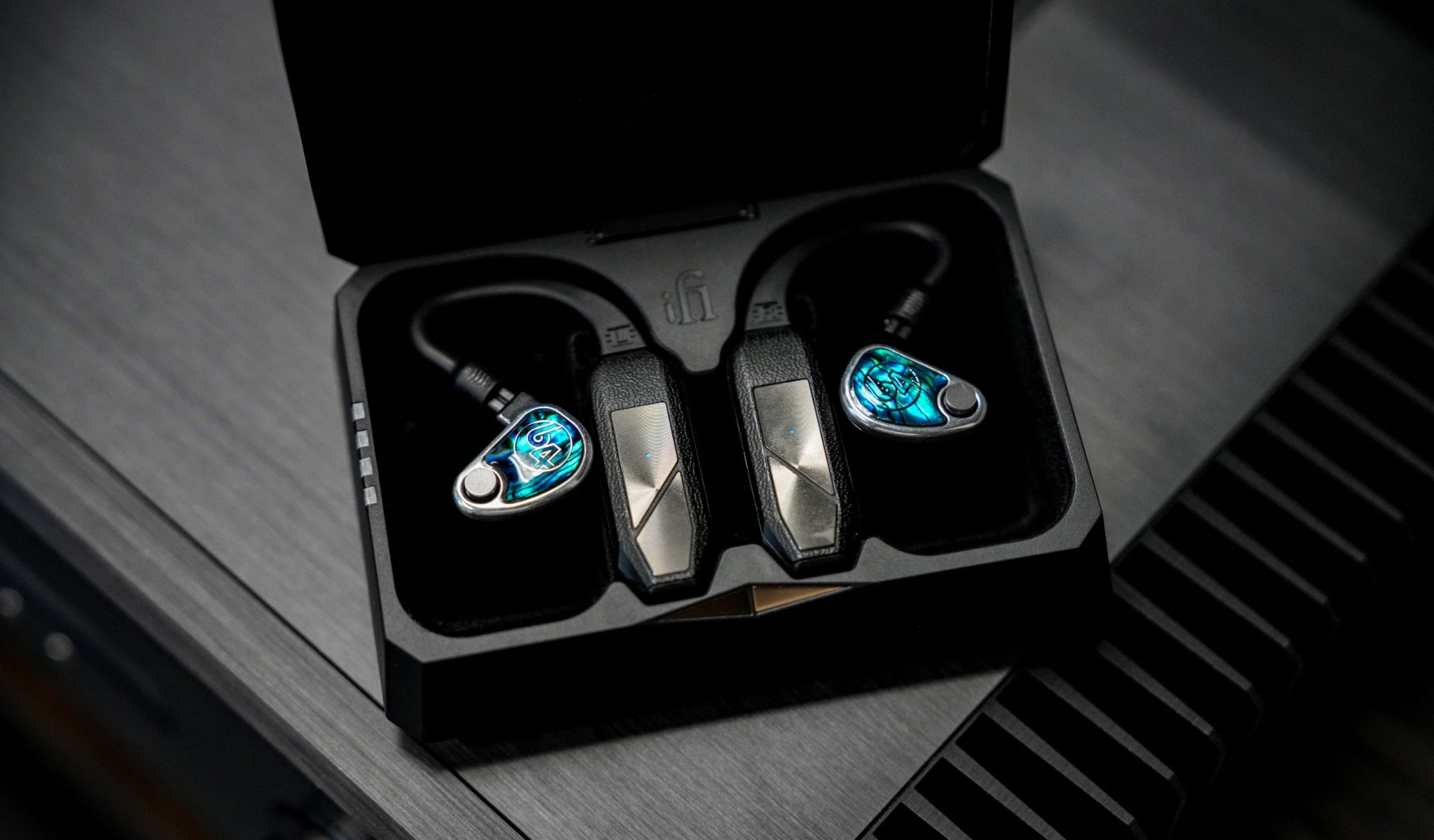 iFi GO Pods with attached 64 Audio earphones in charging case from Bloom Audio gallery