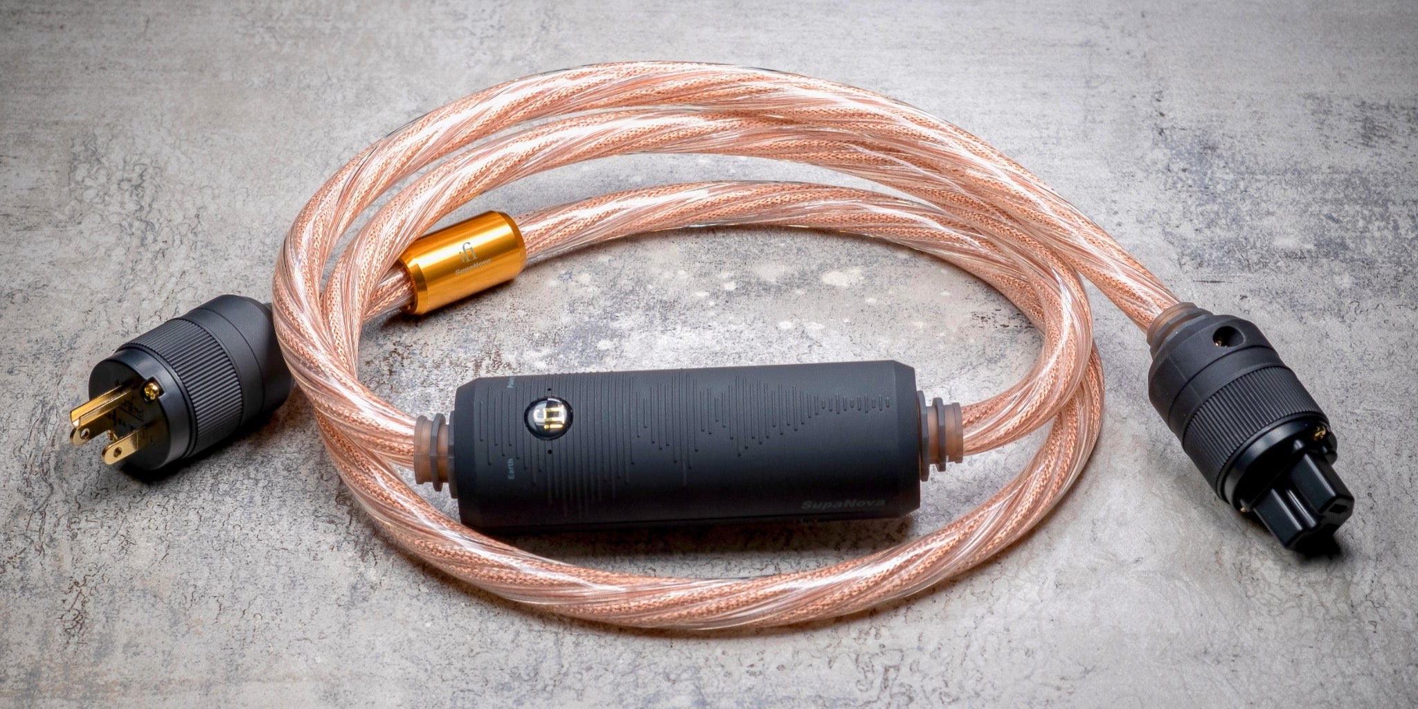 iFi Supanova power cable coiled over gray marbled background