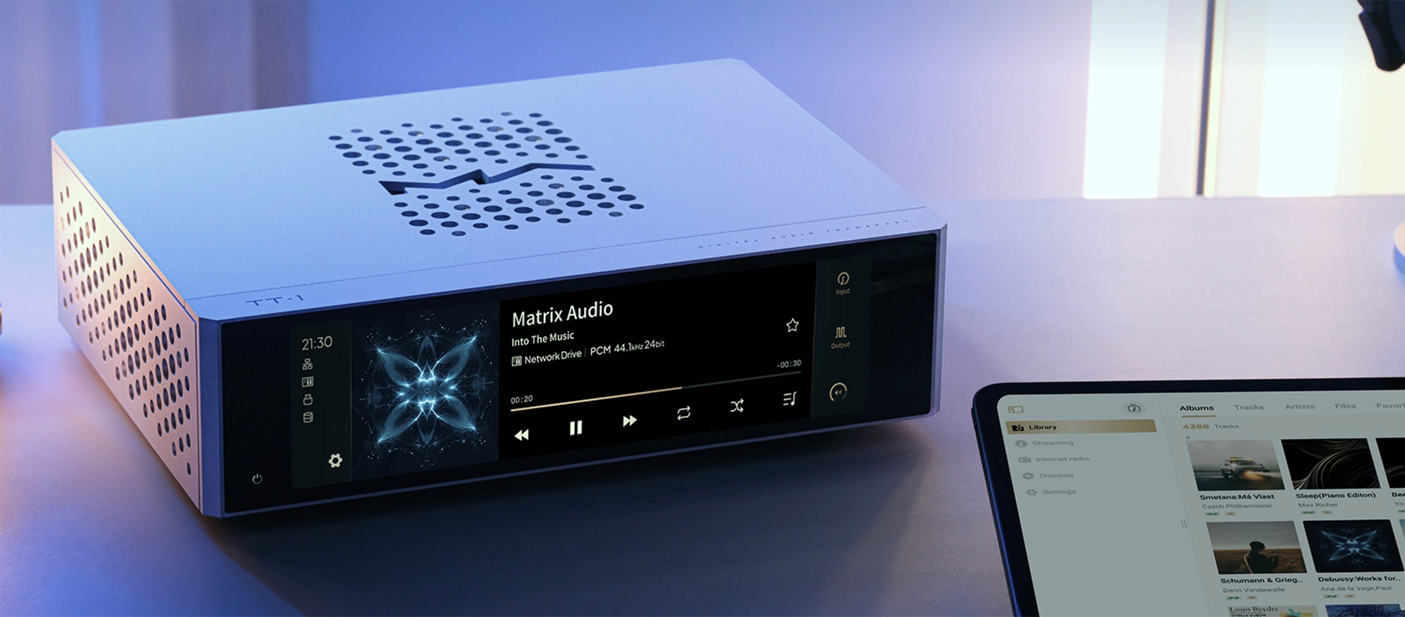 Matrix Audio TT-1 digital audio transport sitting front right 3 quarter on desk with tablet