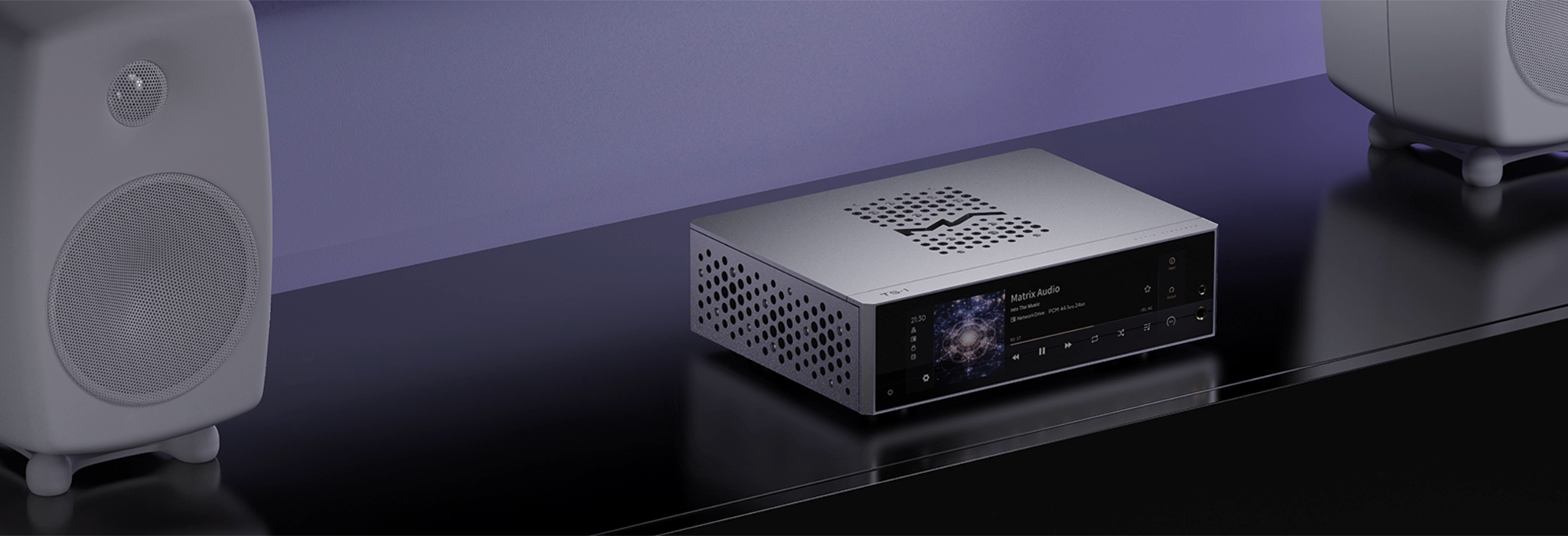 Matrix Audio TS-1 streamer sitting on black cabinet front left 3 quarter angle with two white speakers