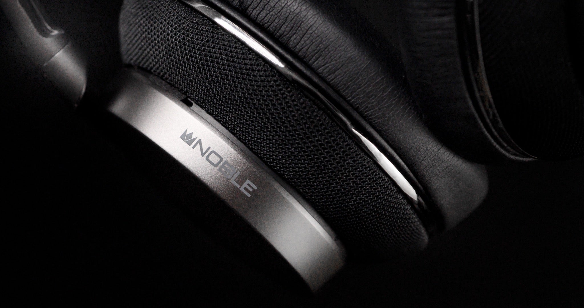 Noble Audio Apollo headphone closeup right earcup over black background