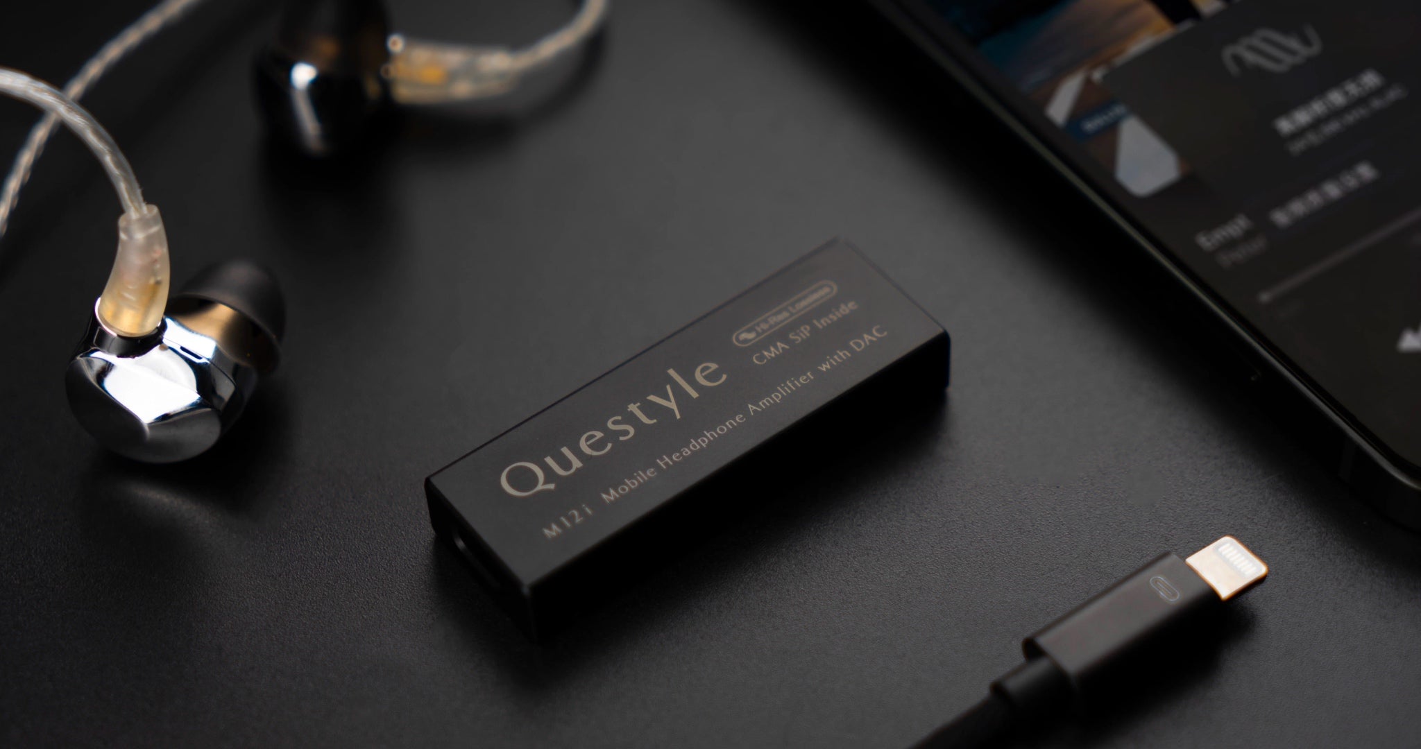 Questyle M12i quarter with detached IEMs, lightning cable and iPhone