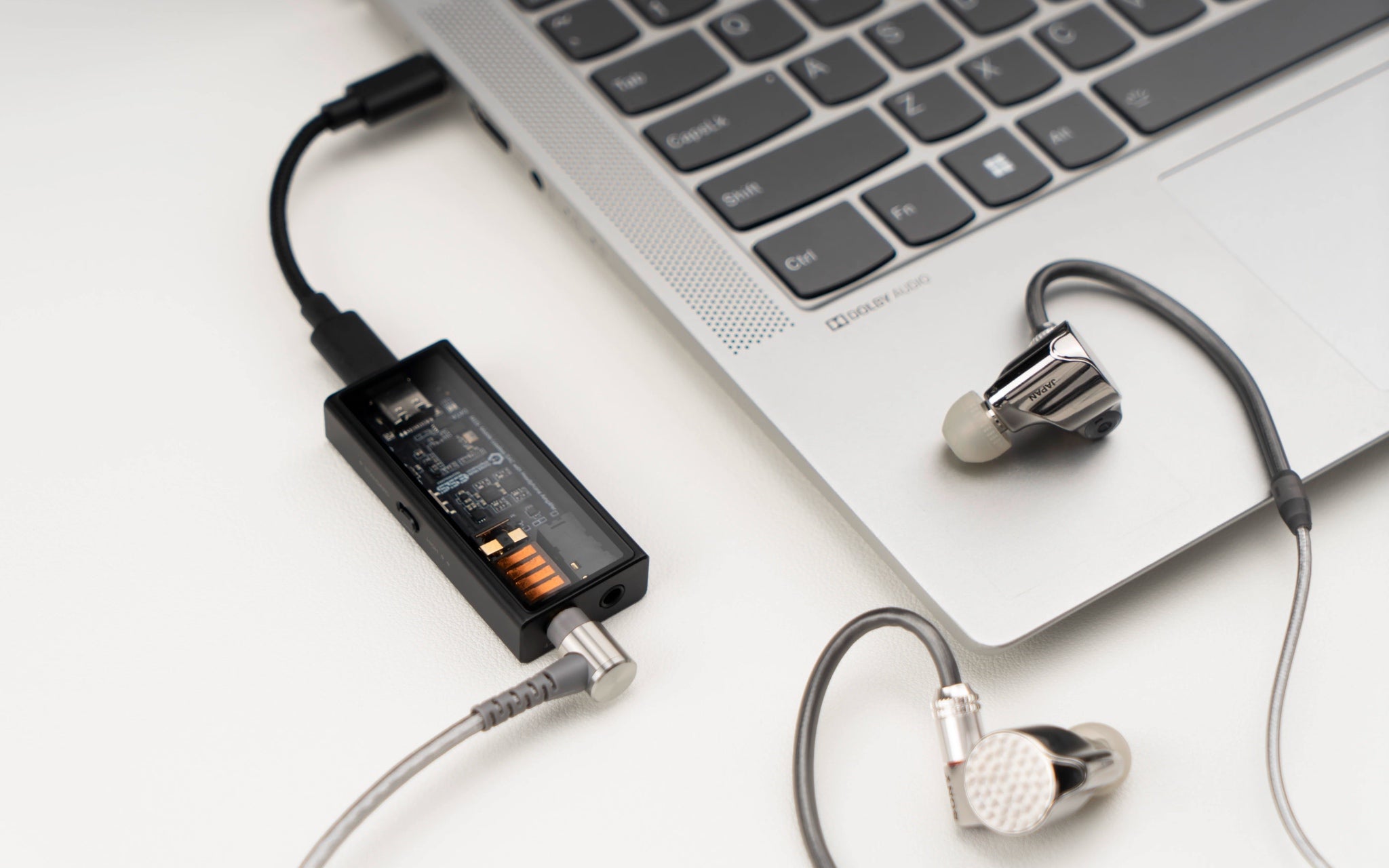 Questyle M15i with attached earphones connected to Macbook