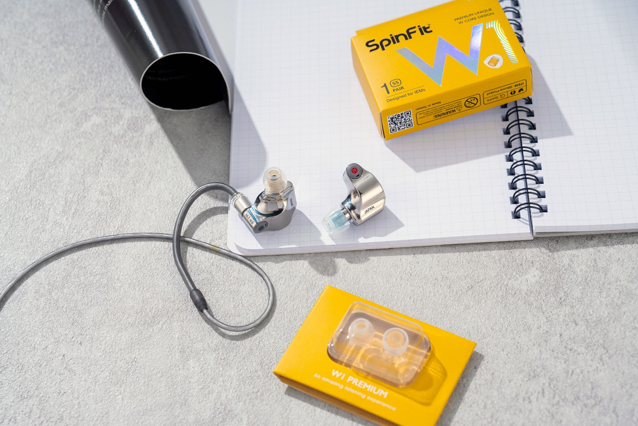 SpinFit W1 SS retail box with insert and loose units attached to earphones