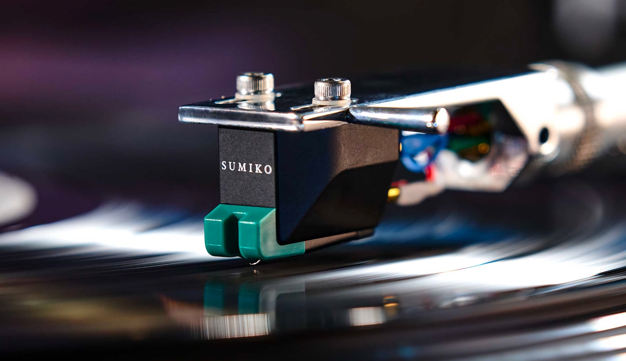 Sumiko Olympia closeup mounted on turntable arm and lowered onto playing vinyl