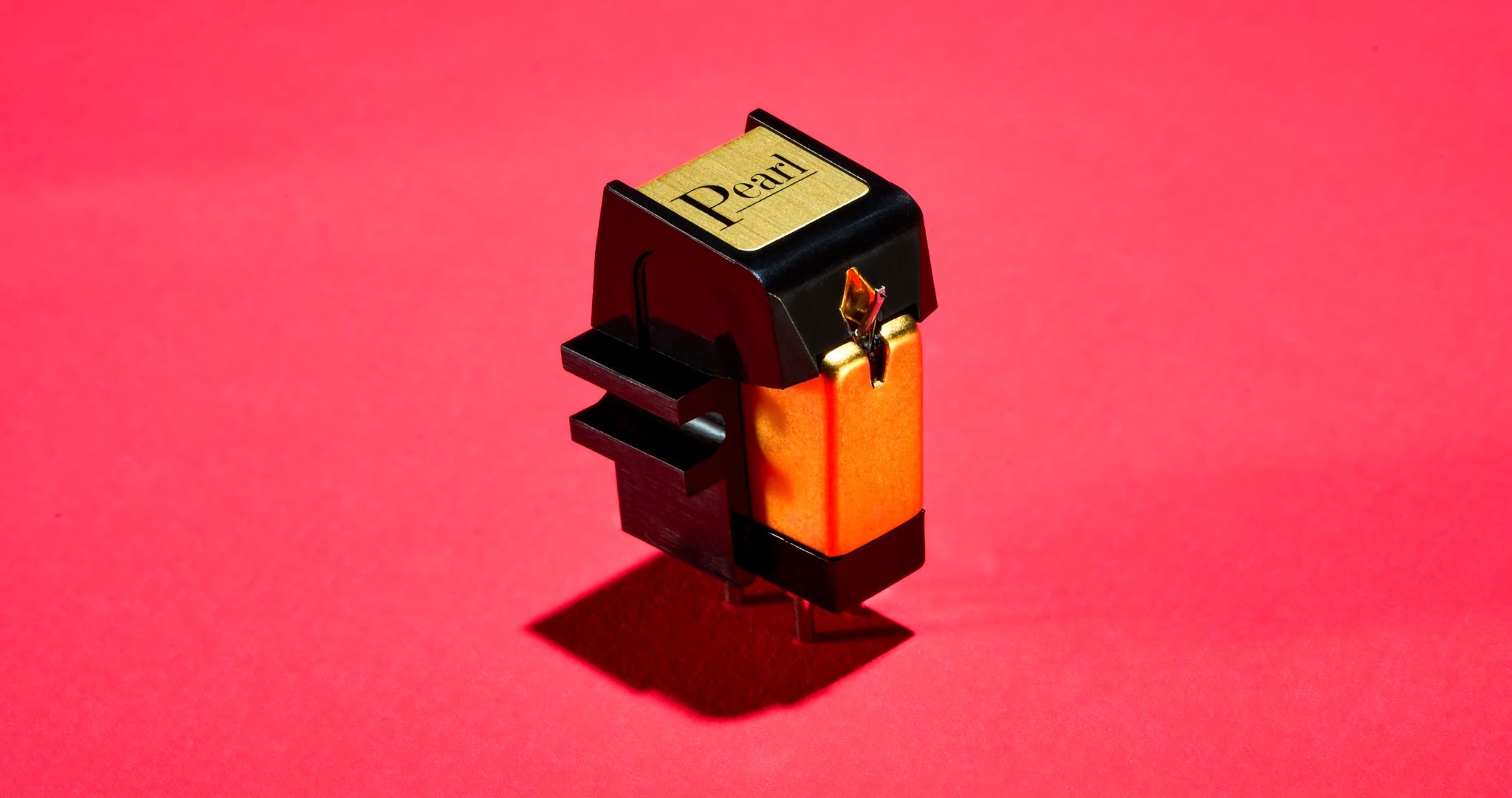 Sumiko Pearl phono cartridge 3 quarter front over magenta background