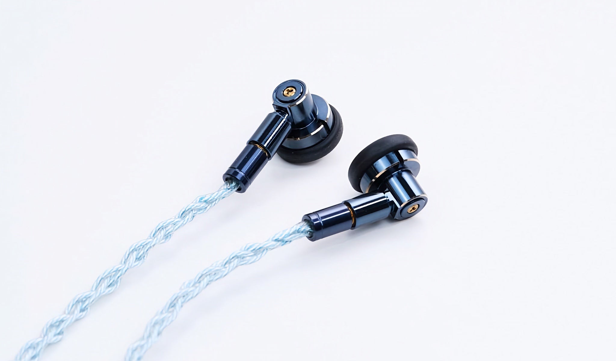 Ucotech ES-P2 earbuds with attached stock cable over white background