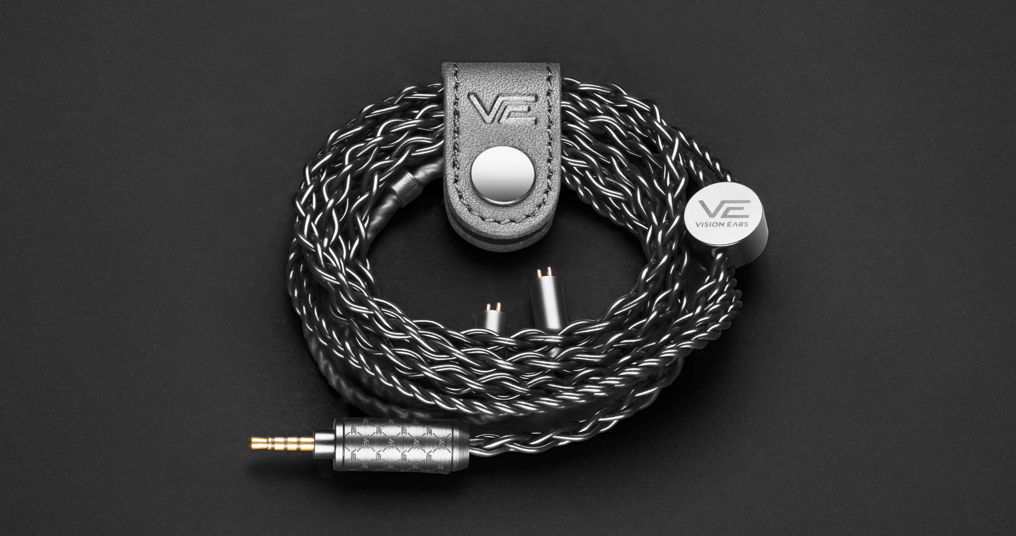 Vision Ears Phonix custom cable coiled over dark background