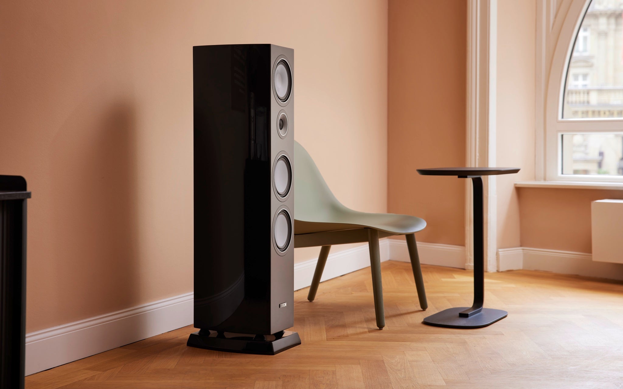 Canton Vento 90 speaker in peach-colored living space with wood floor