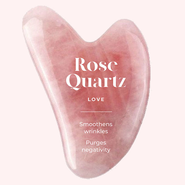 This is an image of rose quartz Gua Sha highlighting the properties of the crystal for face sculpting.