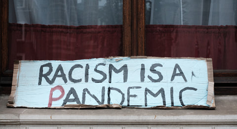 Racism is a pandemic sign.