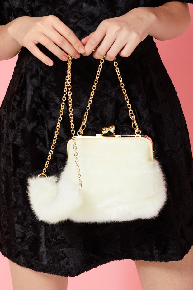 white faux fur purse