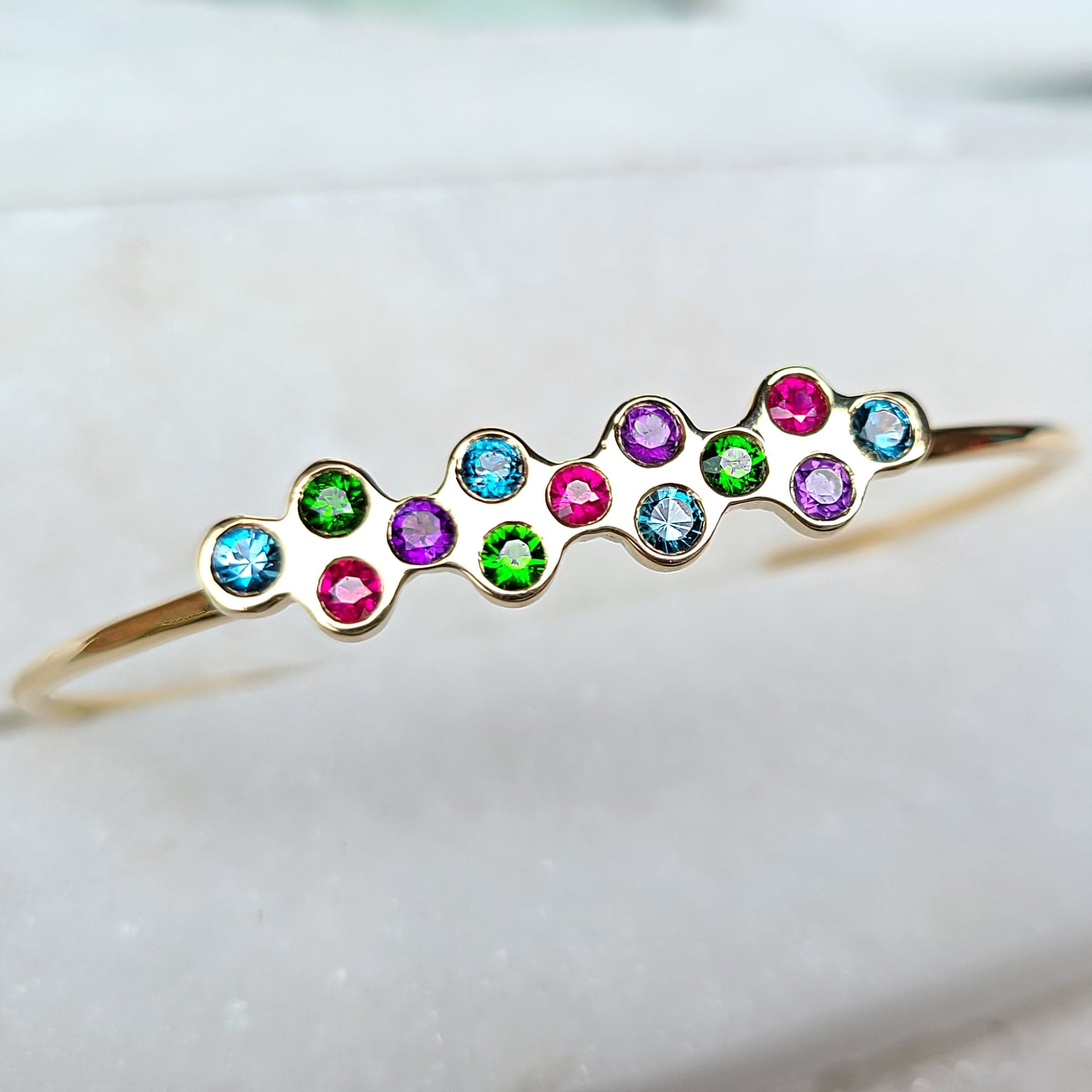 Image of 14K Chrome Diopside, Topaz, Amethyst, and Ruby Cuff