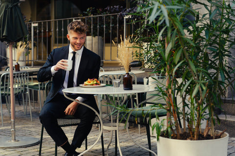 Young man in the cafe wearing a suit