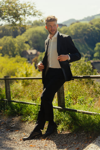 Young man in suit outdoors