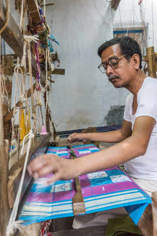 A Weaver from Pochampally weaving an ikat saree