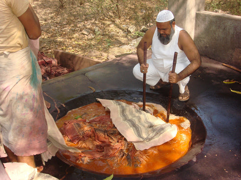 Mohammed Yusuf Khatri, a Bagh printer, boiling the printed fabric in a mixture of alizarin, water and dhavda flowers.