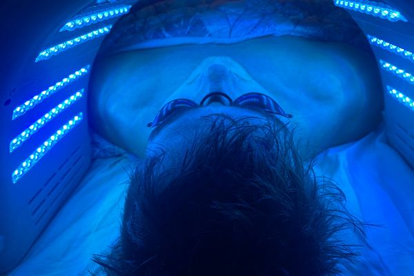 a man using blue led light therapy colour