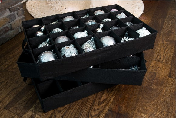 An open Top Pocket Ornament Storage Box filled with Christmas Nutcrackers