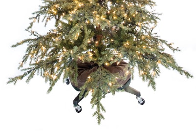 Close up of a decorated Christmas Tree with tree storage bag and rolling stand