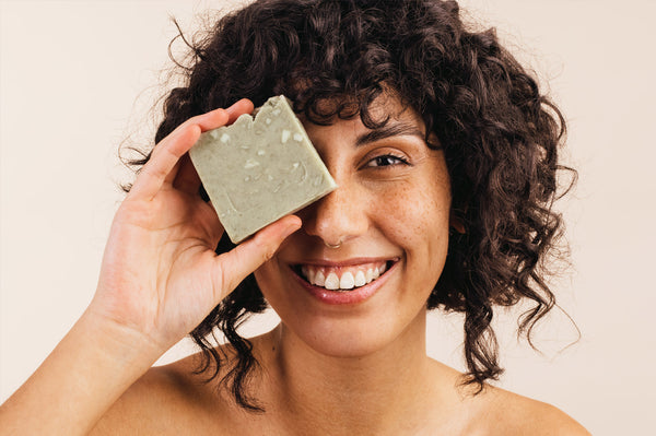 Woman with soap bar - can you use body soap on your face