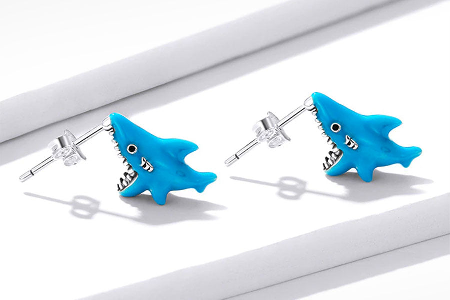 A Pair of Shark Bite Stud Earrings in vibrant blue enamel