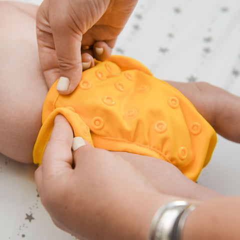 OsoCozy Diaper Cover Being Snapped