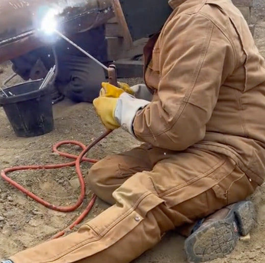 Wear flame-resistant clothing while welding.