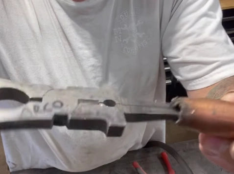 Use pliers to remove spatter from nozzle.