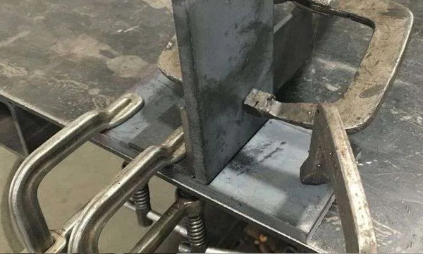 Proper clamping of the metal will help prevent weld distortion