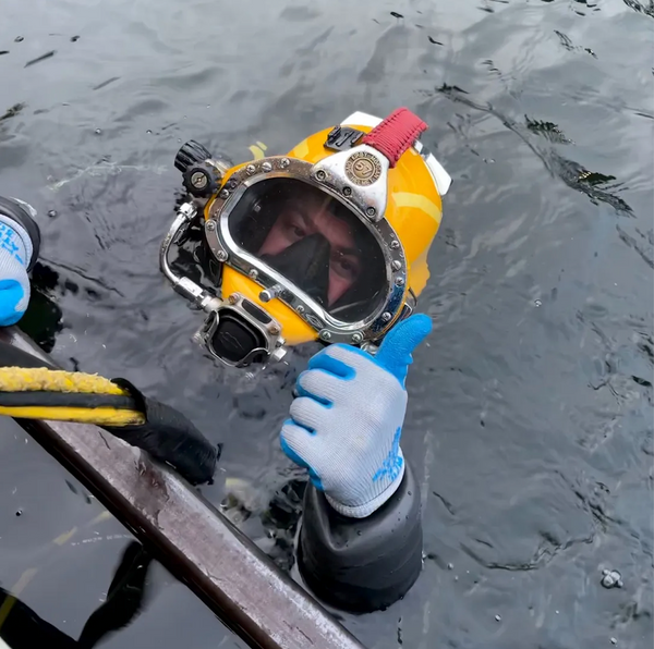 underwater welder is ready to dive into the water