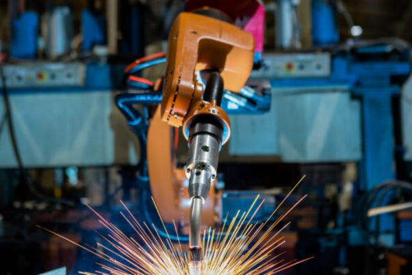 Automated welding uses robots for preprogrammed tasks.