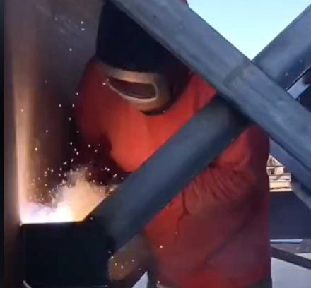 Welding on 3/8 galvanized angle with flux-core dual shield wire.