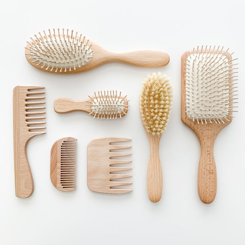 An assortment of wood Redecker brushes and combs 