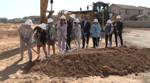 Group of People with Shovels Breaking Ground
