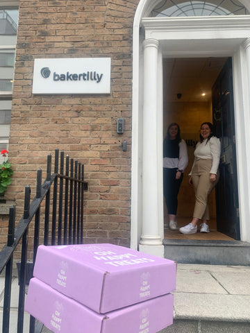 2 boxes of treats in front of baker tilly office in dublin