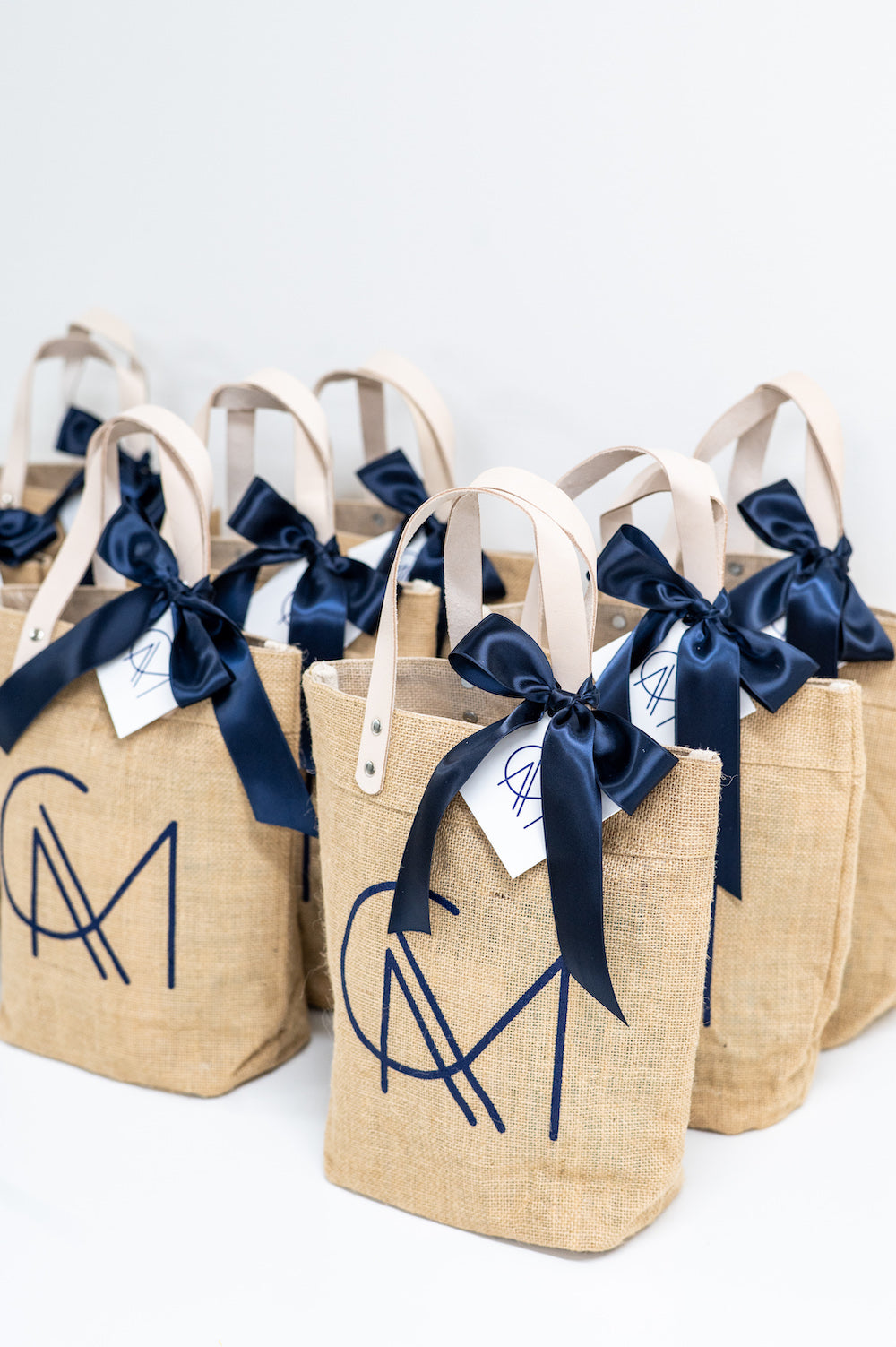 custom wedding welcome gift bags jute beach tote with monogram by Marigold & Grey