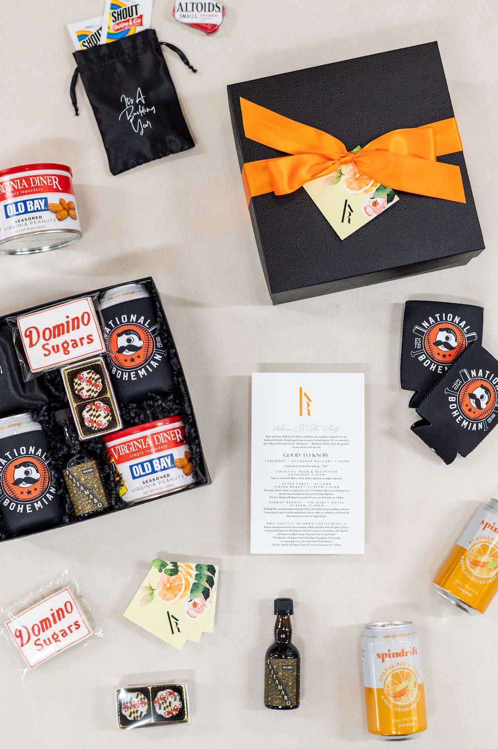 custom DC wedding welcome gift boxes for modern back and orange with Baltimore theme by Marigold & Grey