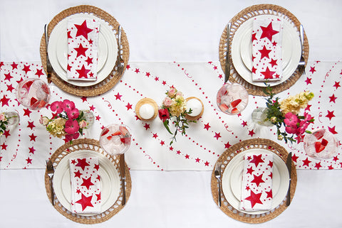 red shooting stars cloth napkins and table runner