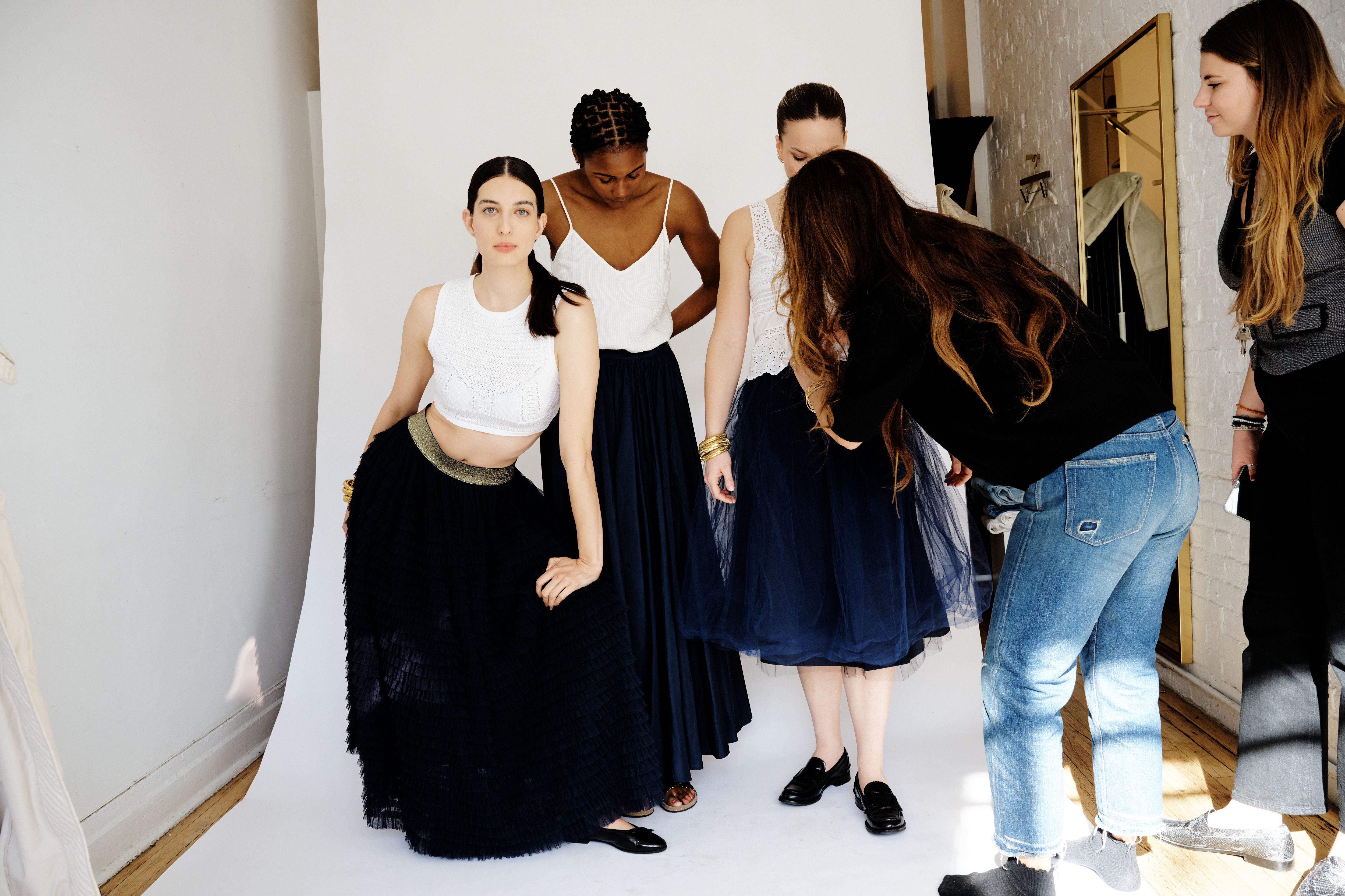 Eva Dayton, founder of Consignment Brooklyn, styling models for shoot