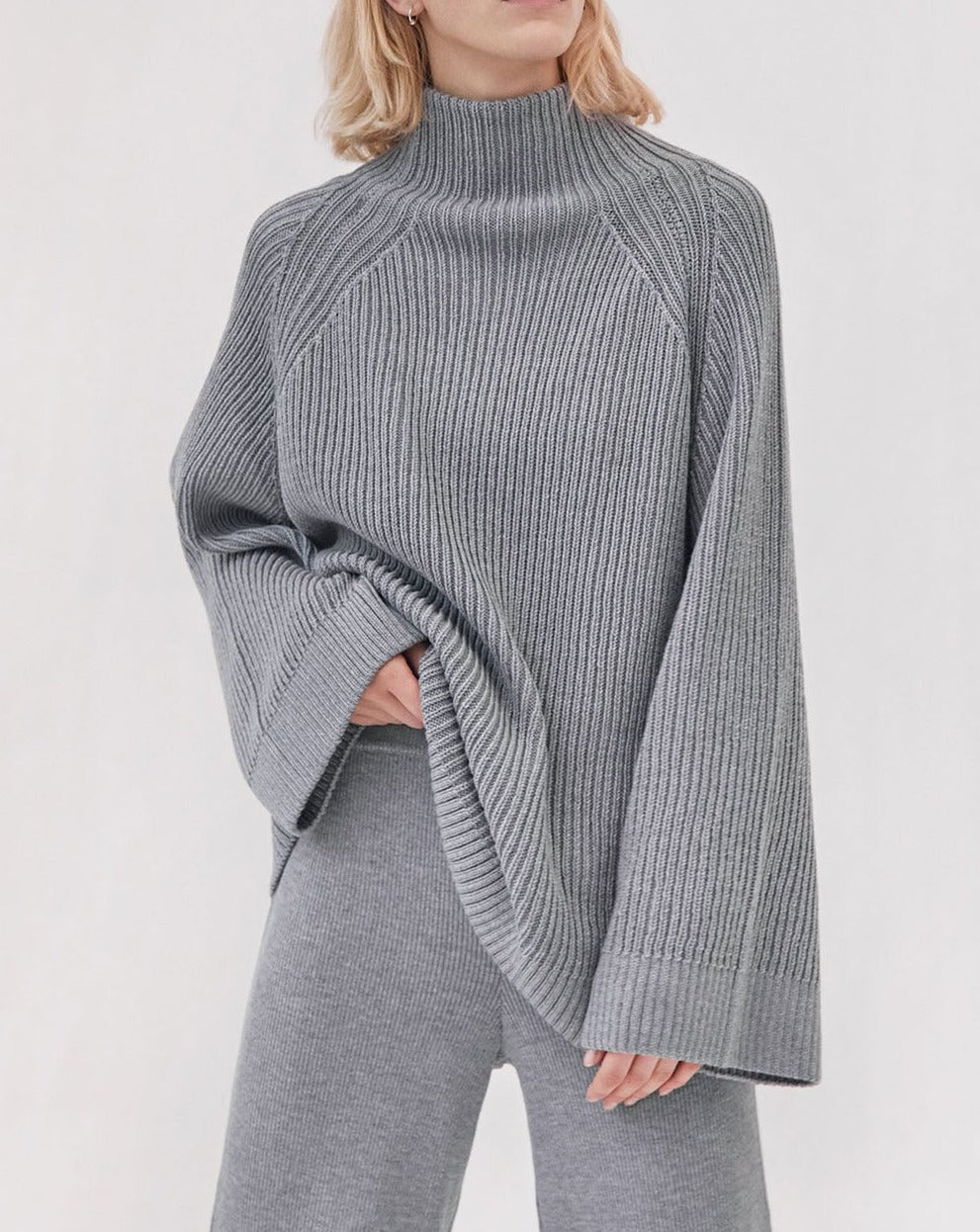 https://cdn.shopify.com/s/files/1/0024/6277/7459/products/4.Milda_Turtleneck_Grey_1800x1800.jpg?v=1674567500