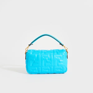 Rear view of the FENDI Mini Baguette Bag in Turquoise Embossed Leather