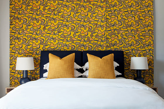 Colour crush / yellow | Vlisco wax print fabric bedroom feature wall at Hallmark House Johannesburg, South Africa