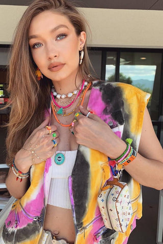 Gigi Hadid wearing a pearl and bead necklace stack 