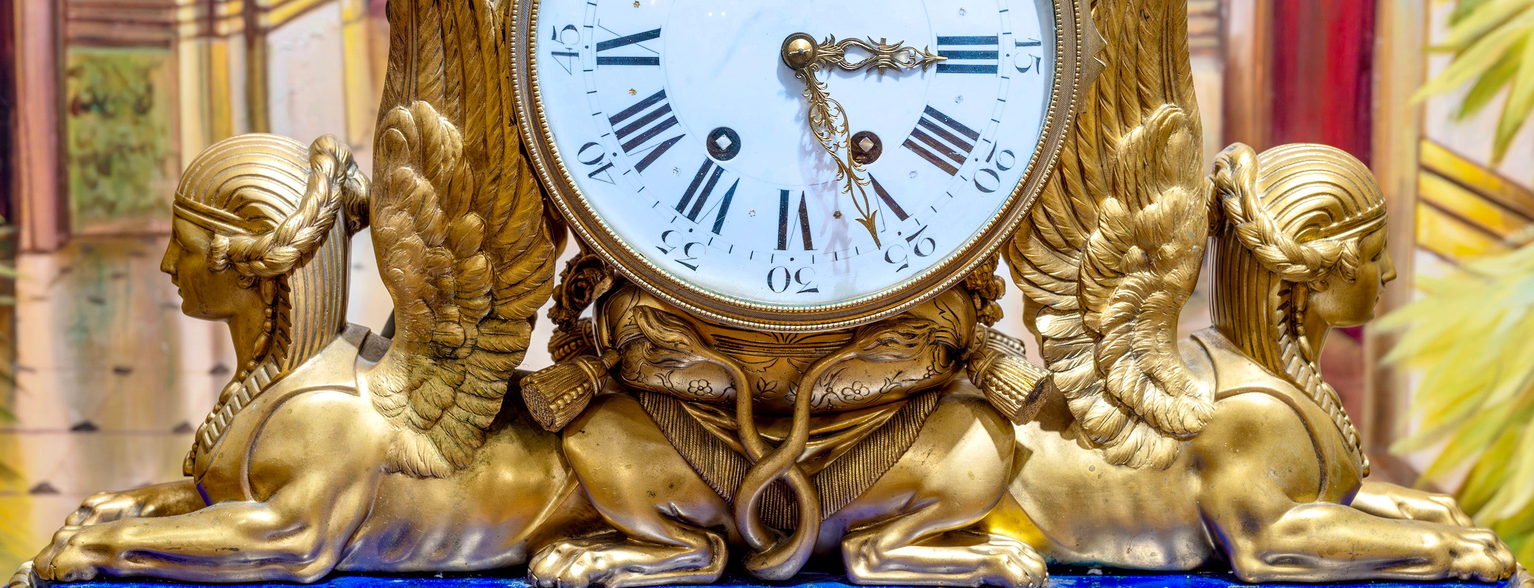 19th century French masterpiece clock with winged bronze sculptures